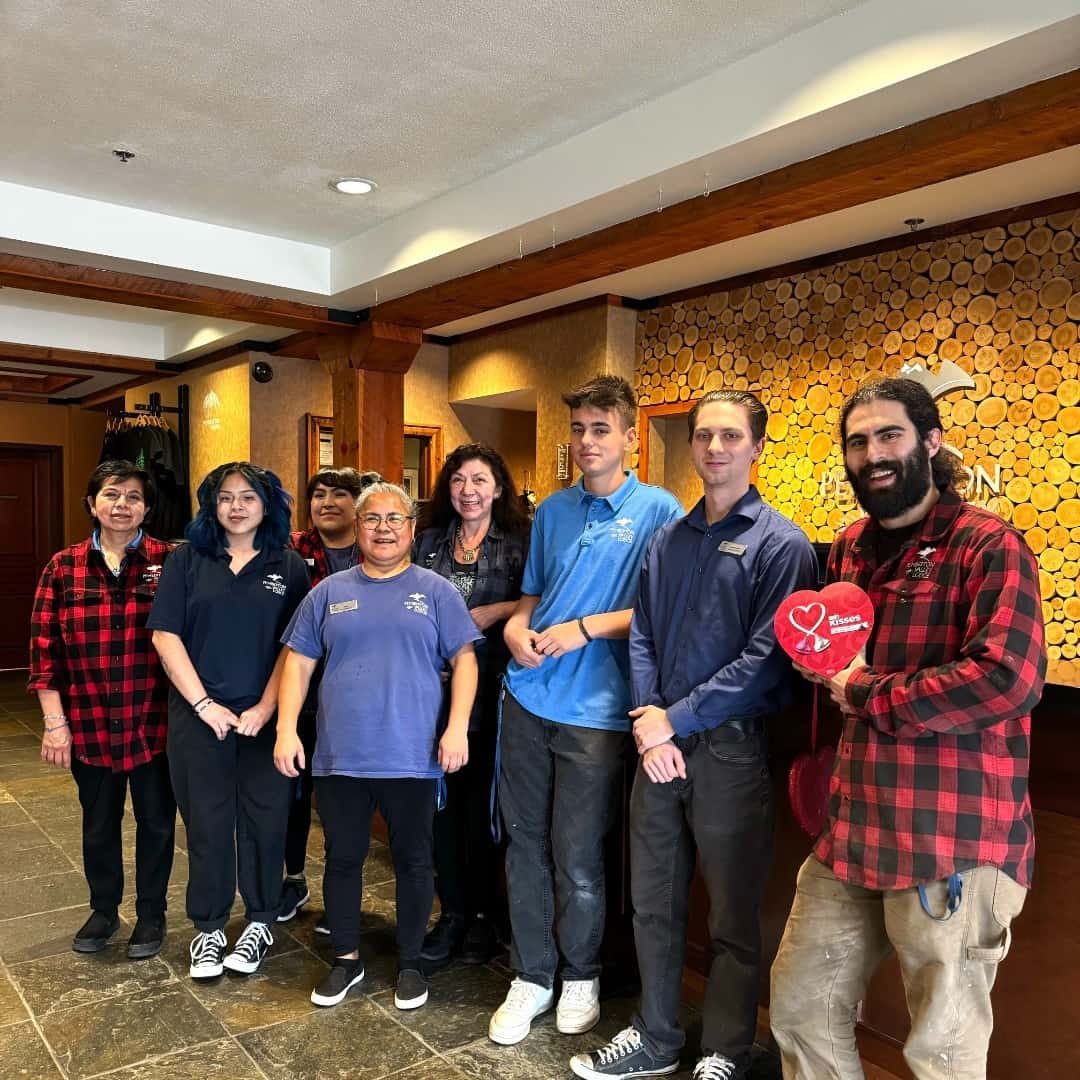 the Pemberton Valley Lodge Team Memebers standing in the front lobby of the hotel